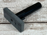 Black Micarta Tapered tang Jig with magnets to hold your blade to the jig and an ergonomic handle and pin to hold the knife in place 